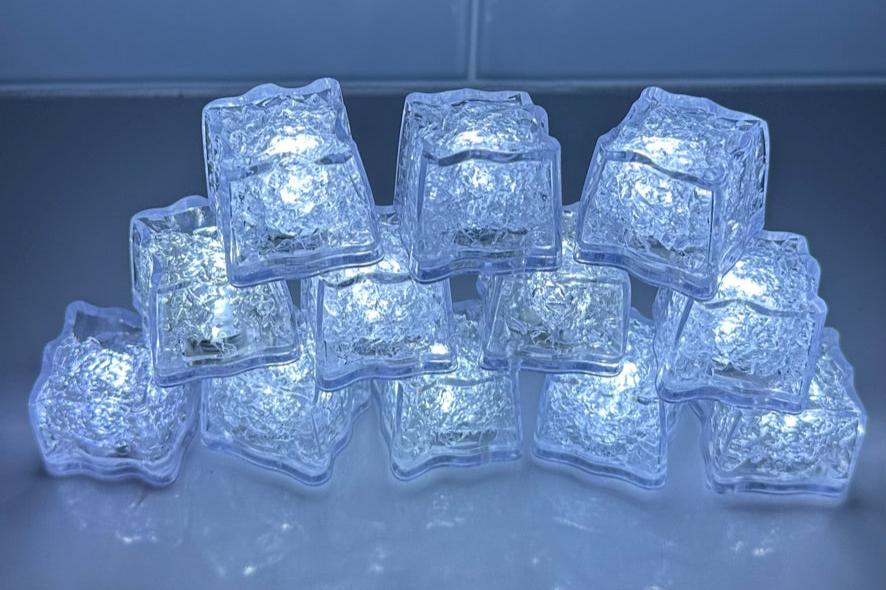 White LED Light up ice cubes with Push Button on/off. Push Button cubes last longer and work in ice, unlike cubes with moisture sensors (which only work when submerged in liquid). When on, the bright color operates in 3 modes: slow flash, fast flash, and steady on. When off, cubes are clear. FDA approved clear acrylic shell is sealed with freezable gel inside and is submersible safe in beverages. They are fun LED party lights