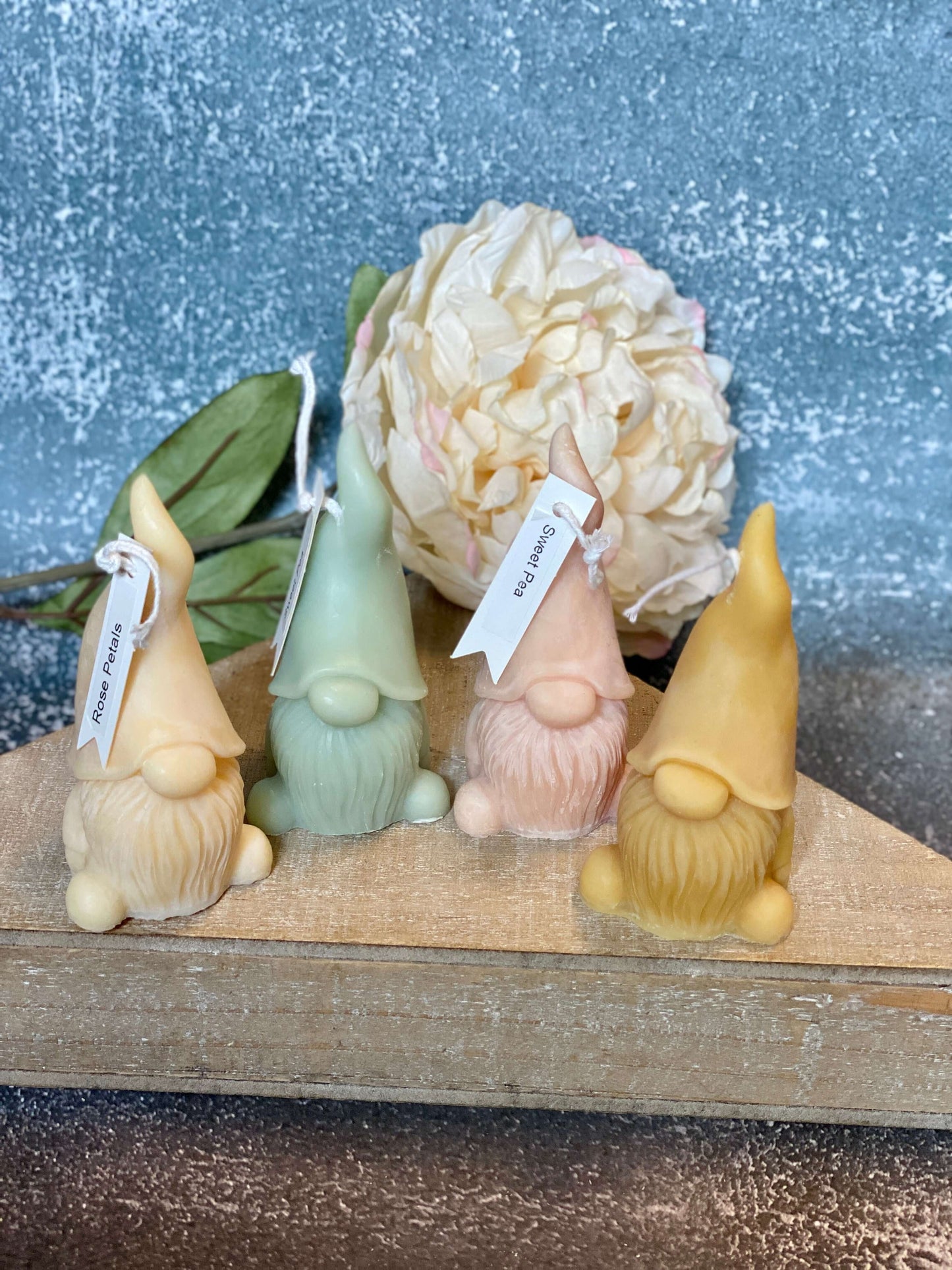 Scented candle with gnome sculpture