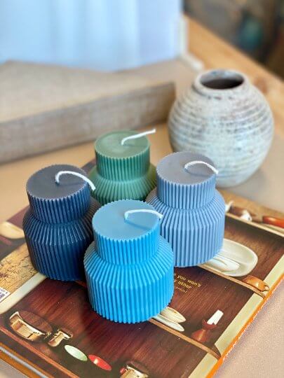 Textured pillar candle with pedestal base